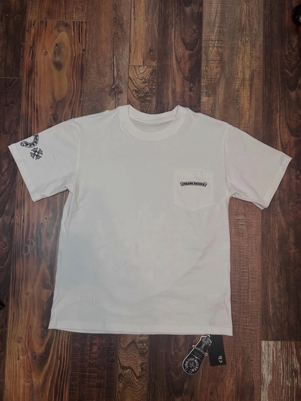 white short sleeve, multi colored crosses